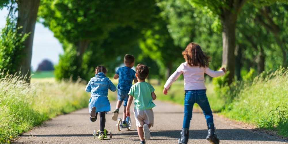 School aged children skating and running down a tree lined path Premier Home Finders Guide to Goverment Schools in Sydneys North Shore