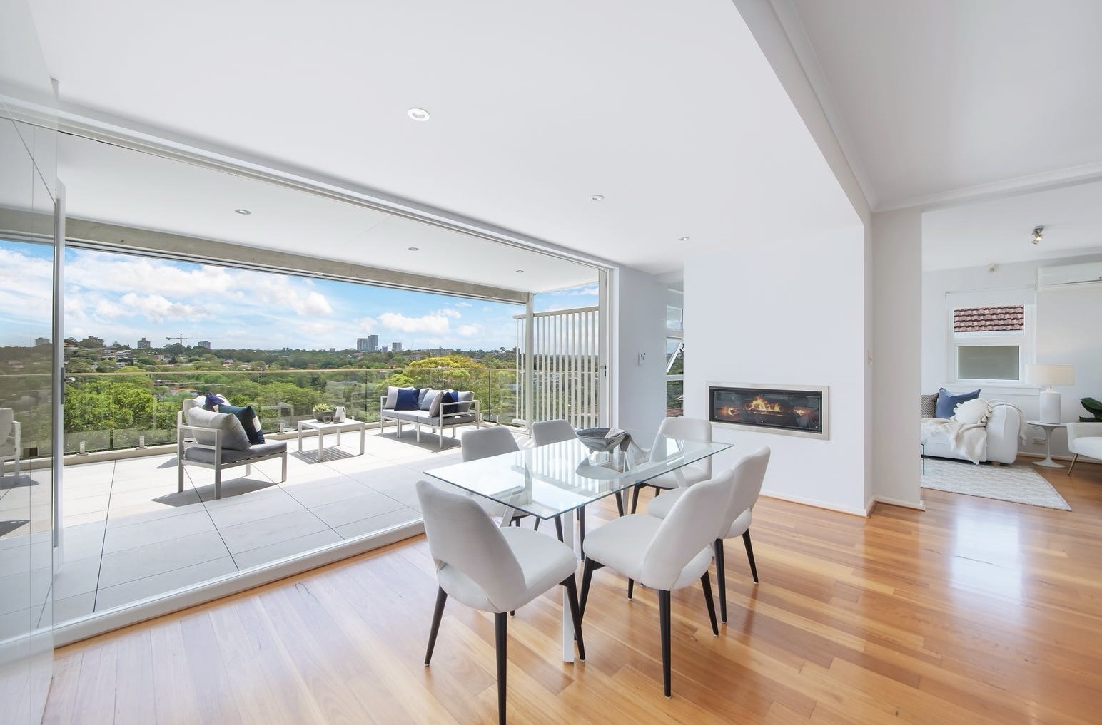 Open lounge and dining room with doors leading out to a balcony with district leafy news this unit at 1/6 Ellalong Road, Cremorne, NSW 2090 was the top unit sale in April 2026