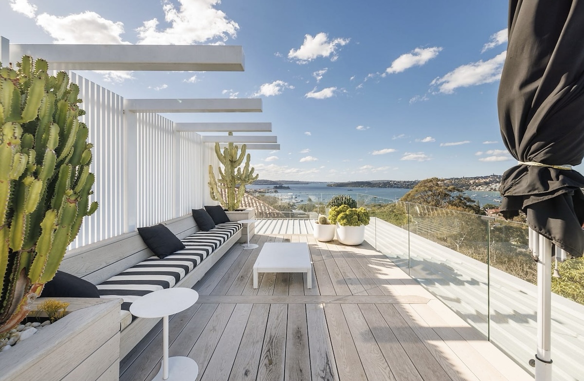 outdoor roof top terrace with blue and white striped upholstery this home at 55A CRANBROOK ROAD, BELLEVUE HILL was sold in December 2025 for $11m