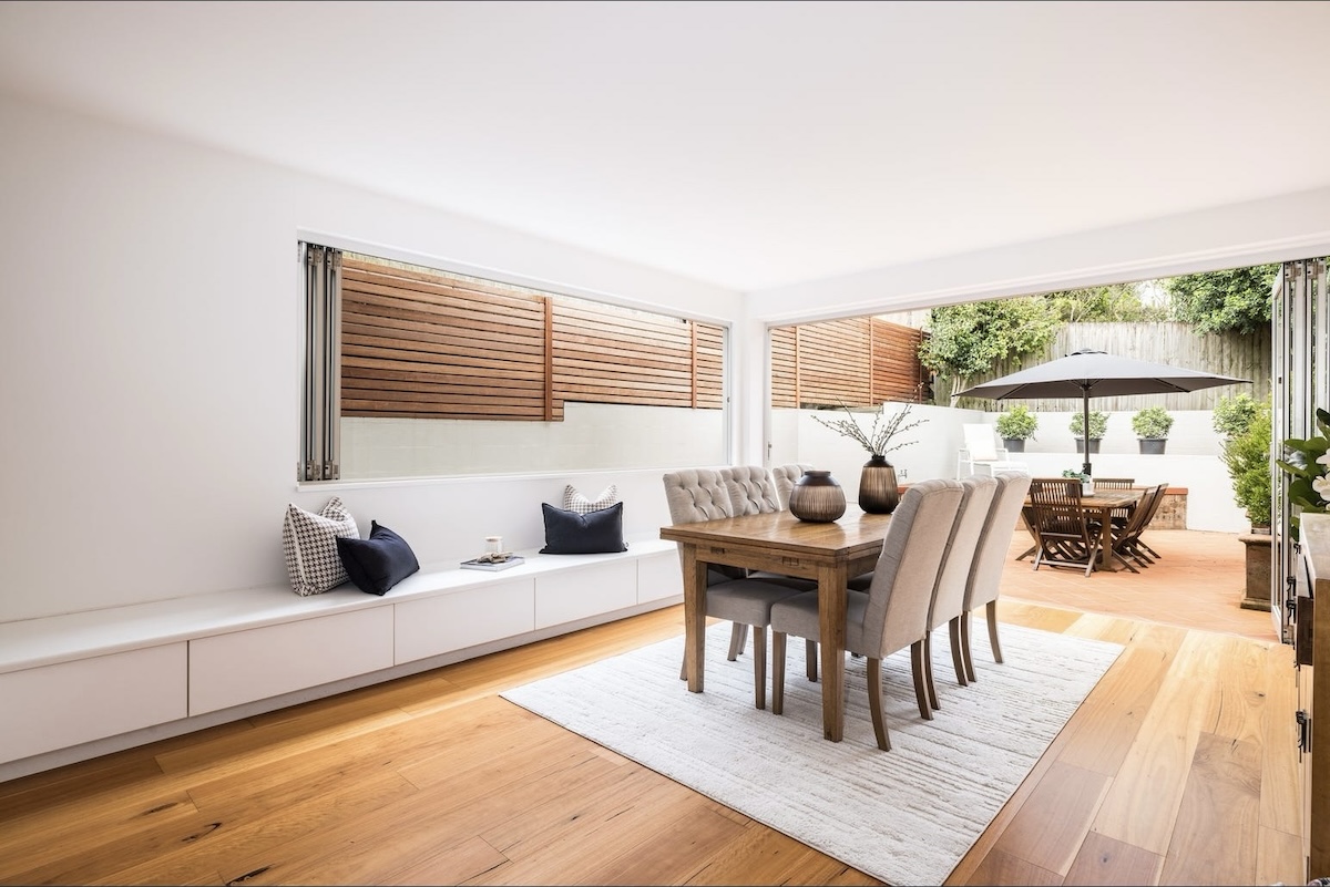 Open lounge leading out to a paved outside area with table and chairs - 71 Benelong Road, Cremorne, NSW 2090 - top home sale in Cremorne for April 2026
