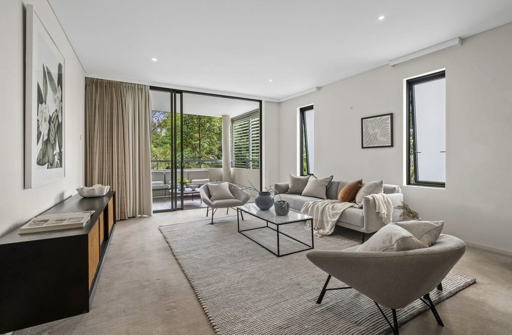 Lounge room with double sliding doors leading to the balcony this was the Top unit sale in April 2026