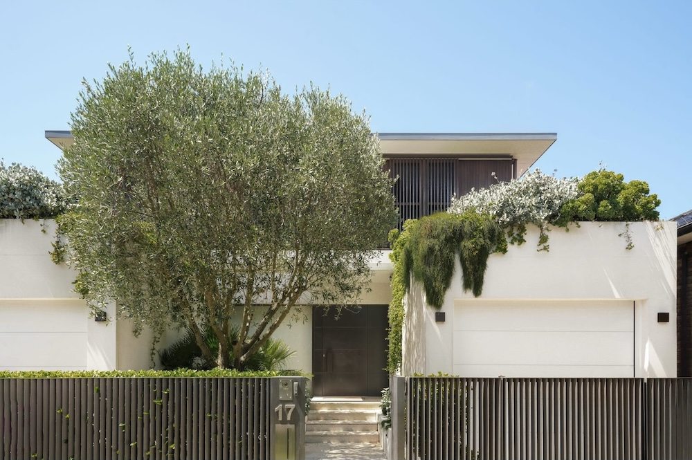 The front facade of a modern home with an overhanging garden cascading over the garage this was the top home sale in Bellevue Hill in April 2026 - 92 Victoria Road Bellevue Hill NSW 2023