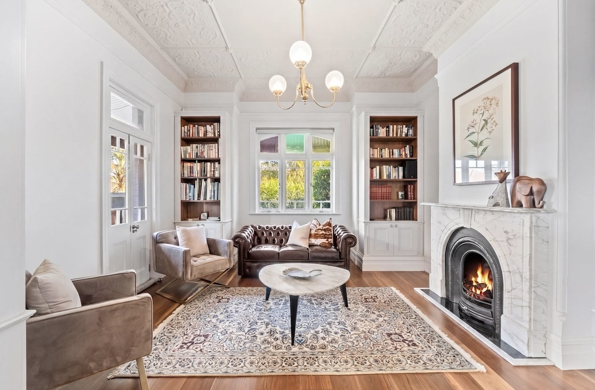 31 Hayes Street in Neutral Bay the interior lounge area with open fire place high ceilings and built in book cases this property was the top home sale in July 2026