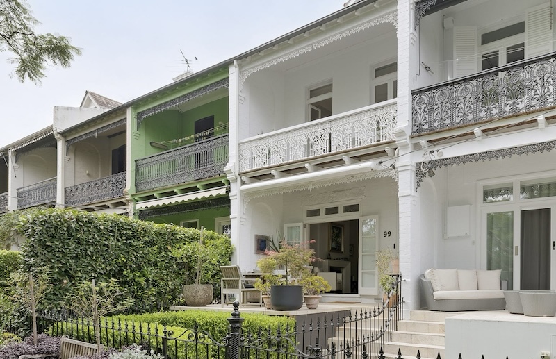 the facade of99 Adelaide Parade, Woollahra, NSW 2025 showing a white two story terrace with balcony overlooking a partere garden this was the top home sale in this suburb for July 2026